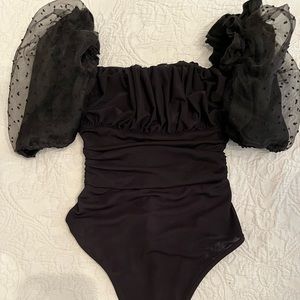 Black puff sleeve bodysuit.